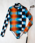 Tye Dye Bodysuit! Its long sleeve, sustainable fabrics, and 15 UPF make it an ideal choice for sunny days on the golf course and late nights with your golf girls. Made in the USA for unbeatable quality,