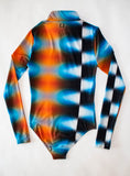 Tye Dye Bodysuit! Its long sleeve, sustainable fabrics, and 15 UPF make it an ideal choice for sunny days on the golf course and late nights with your golf girls. Made in the USA for unbeatable quality,
